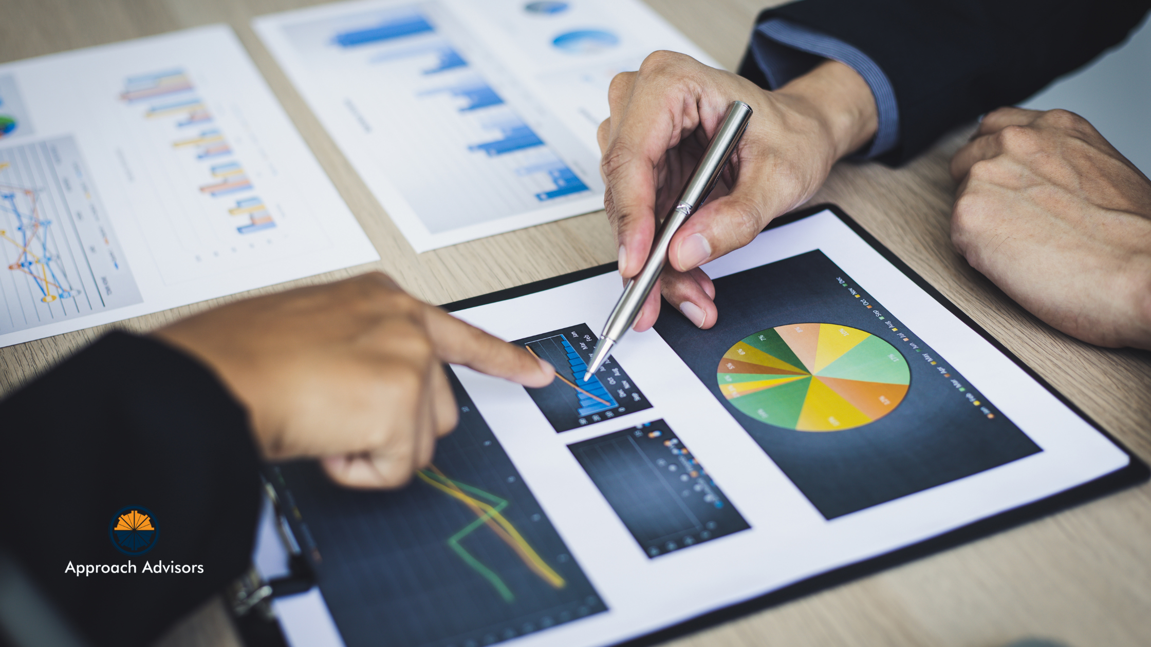 Business professionals analyzing charts and graphs to evaluate financial planning and operational efficiency strategies.