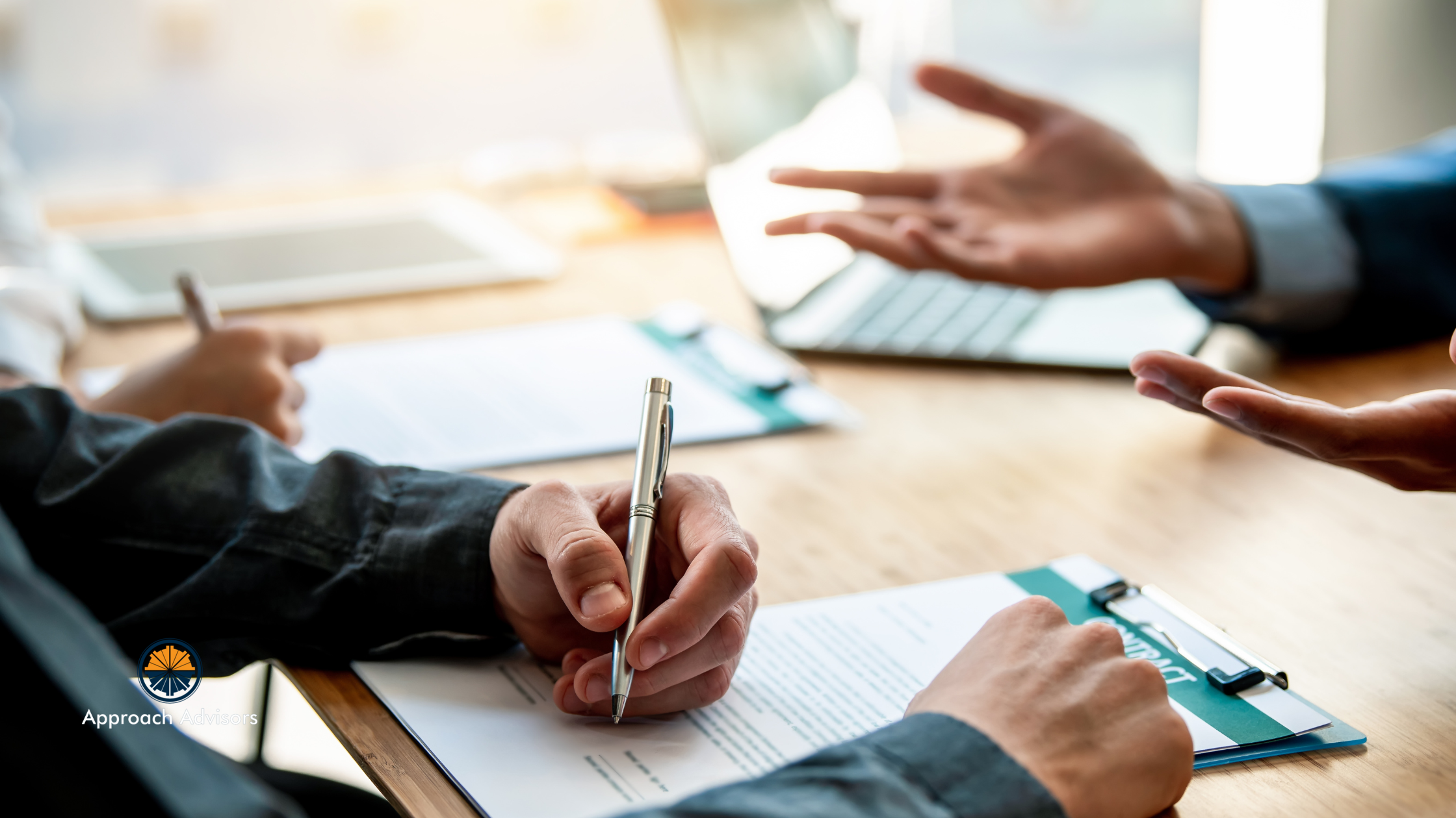 Business professionals discussing documents and budgets at a meeting table, representing collaborative Financial Planning for strategic growth and risk management.
