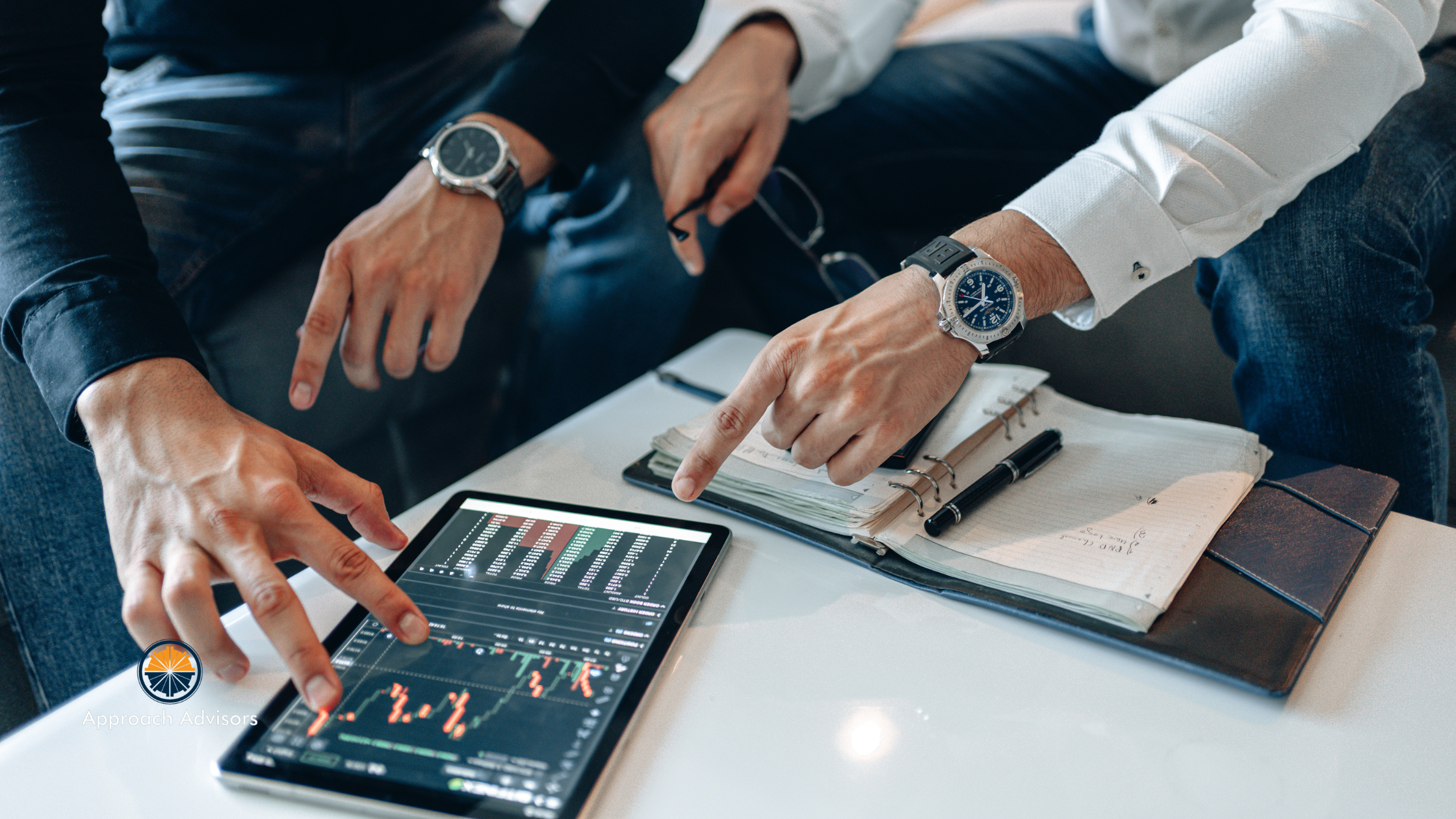 Business professionals reviewing charts and data on a tablet during a financial meeting, representing financial trend analysis for strategic planning, forecasting, and business performance evaluation.