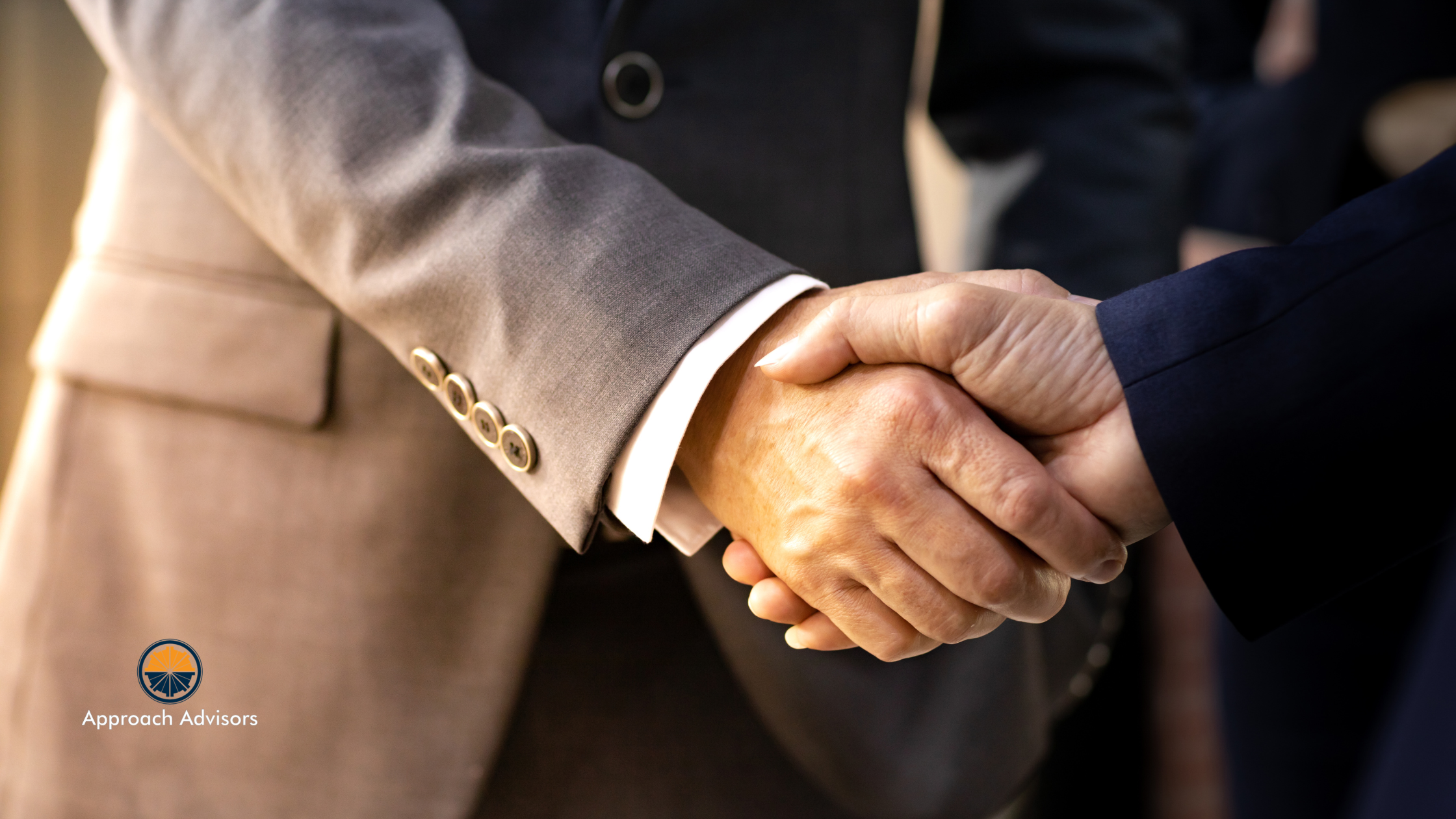 Two men shaking hands to discuss How M&A Clarity Enhances Your Exit Readiness Checklist