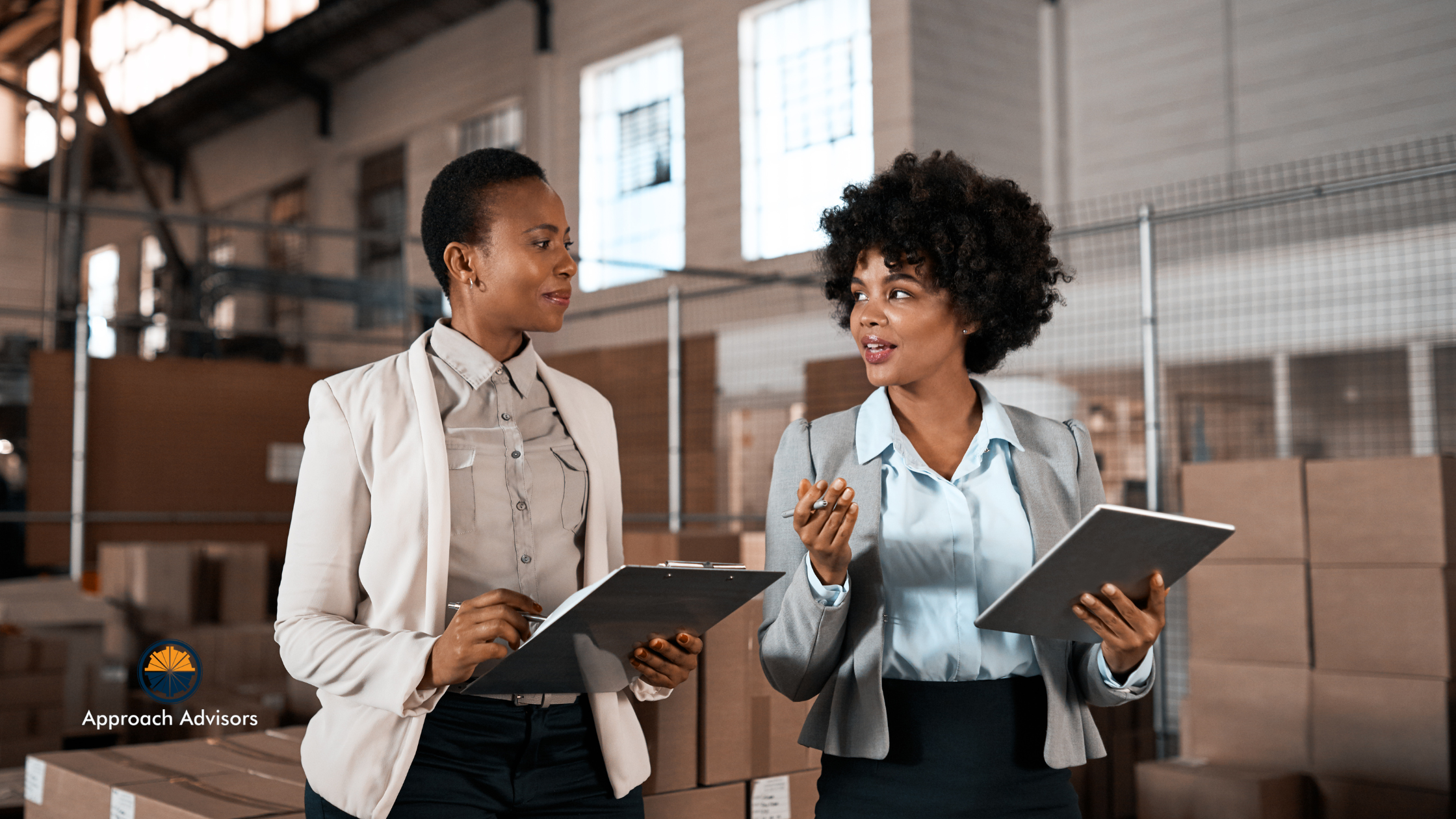 Two professional women with clipboards discussing how Operations often get ignored in exit planning, but they shouldn’t. Buyers want profitable, predictable businesses. That’s why your exit readiness checklist needs to include operational improvements that increase value and reduce buyer friction.